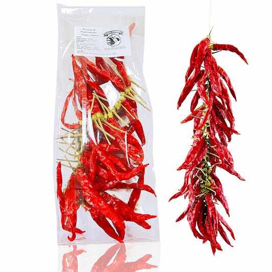 Treccia di Peperoncino "CORNETTO Calabrese", SECCO. Treccia di Peperoncino stagionale (no serra), realizzata a mano con ago e filo, con cornetto Calabrese coltivato in Calabria Il peperoncino Calabrese è un condimento molto popolare in Calabria e ormai nel mondo. Per dare un tocco speziato e piccante ad ogni tua ricetta.